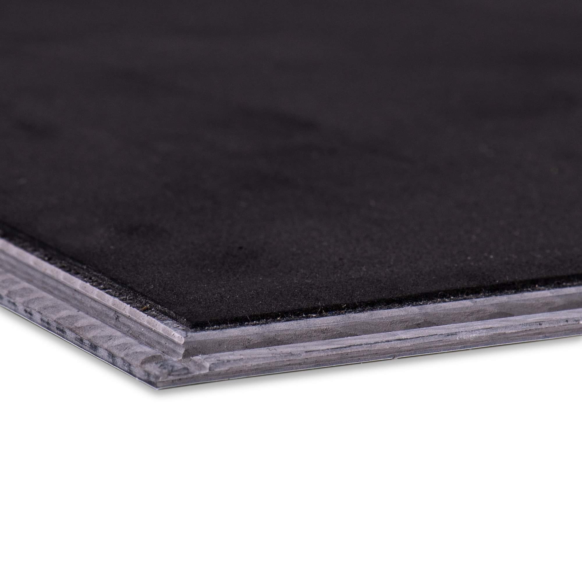 Close-up of the factory-attached underlayment on the underside of a luxury vinyl plank